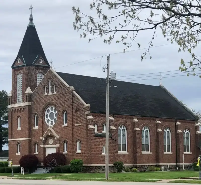 Sacred Heart Church, a brick church with a steeple, in Oconee, Illinois