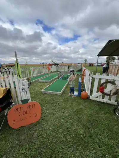 Children playing putt putt golf